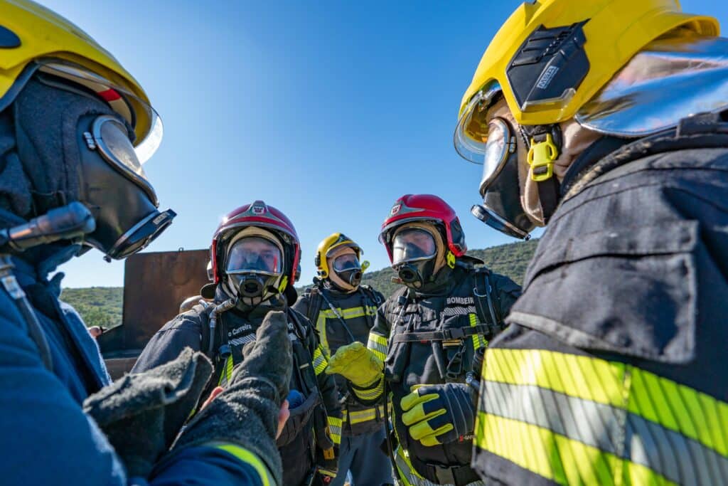 Fire Chief Raul instructs volunteers before fire exercises