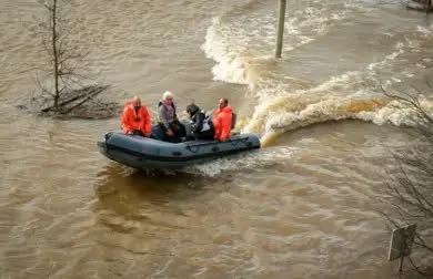 Image of voter being carried to polling station by boat (tthis shot was taken during the first round of voting last week)