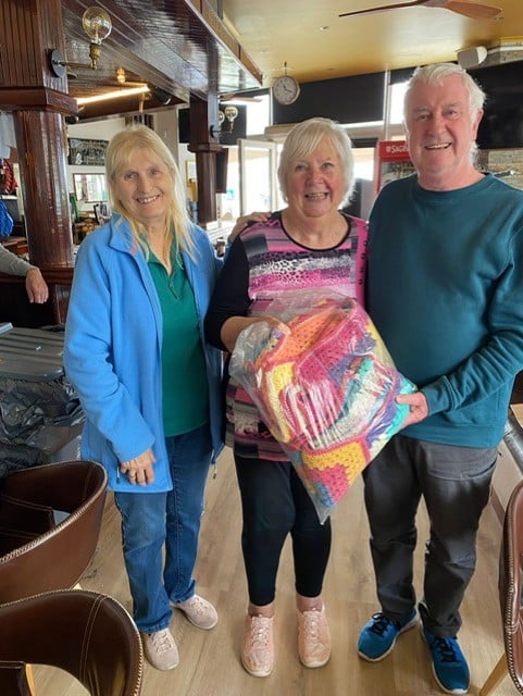 Sheena Rawcliffe (centre) from the Algarve Knitting and Crochet Group donated €300 to the CCCA. Pictured with Lesley and David