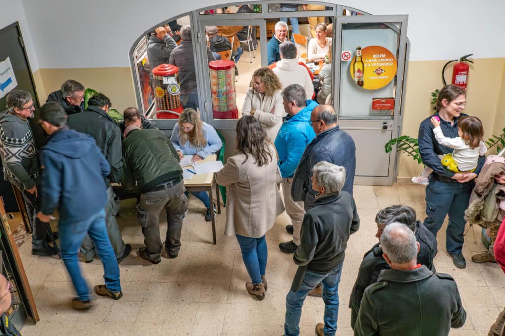 Voters sign in to the assembly before the vote to dismiss the board