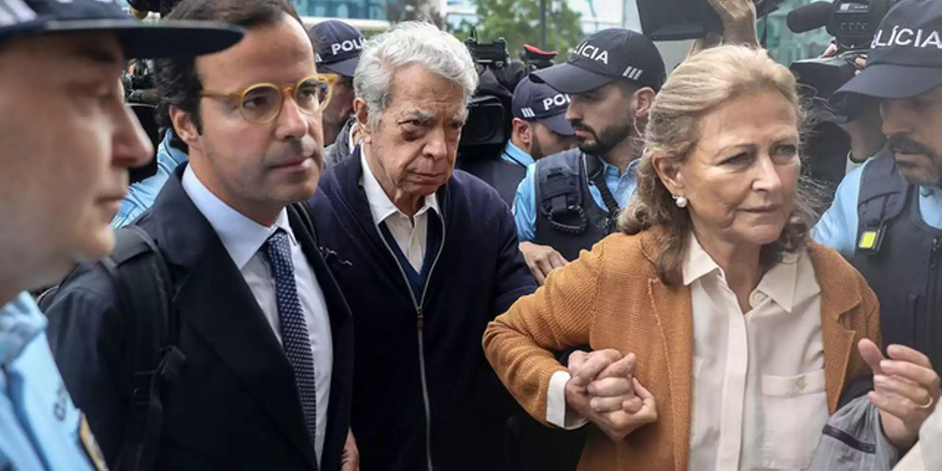 The insistence on making Ricardo Salgado 'stand trial' is turning this particular 'corruption trial' into something very dark. Image of Mr Salgado being led into court by his wife and defence lawyer taken by Andre Kosters/ Lusa