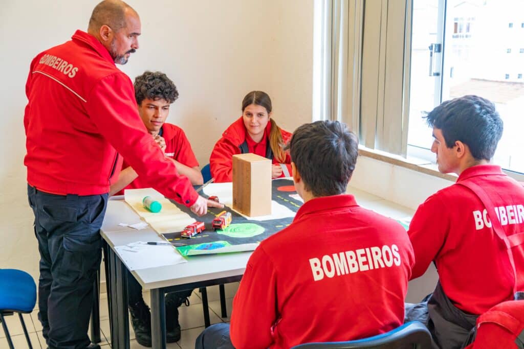 Pedro Rafael instructs high school students about urban firefighting logistics