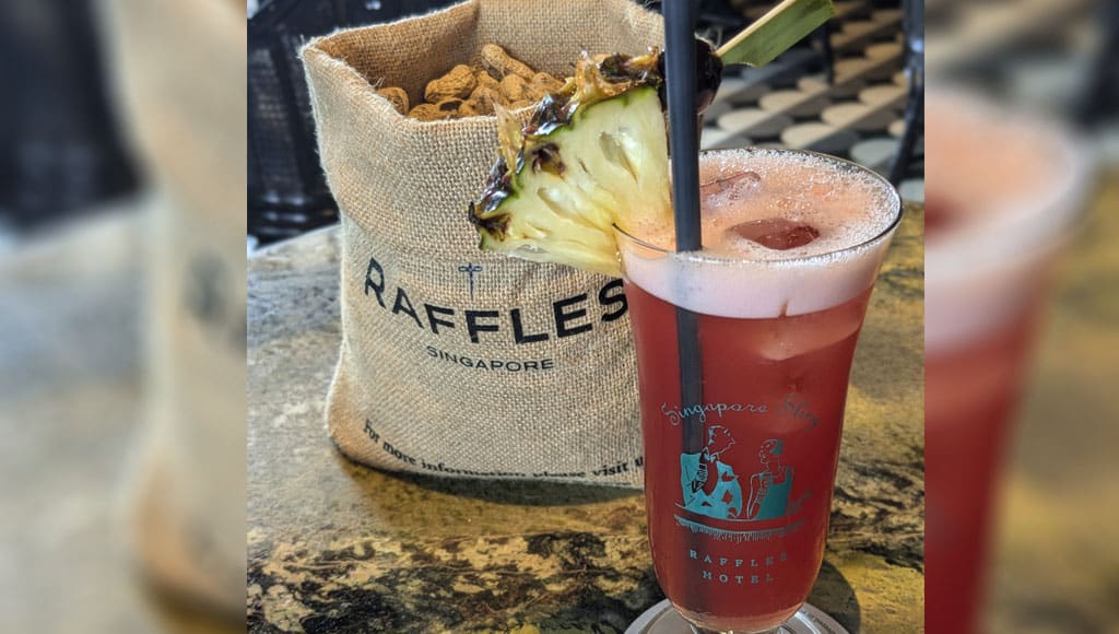 Singapore Sling and bag of peanuts at the Raffles Hotel Long Bar in Singapore
