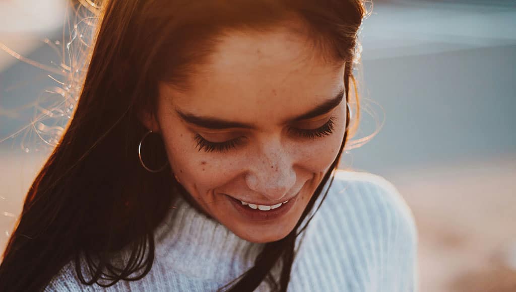 Woman smiling (Yuvraj Singh-unsplash)